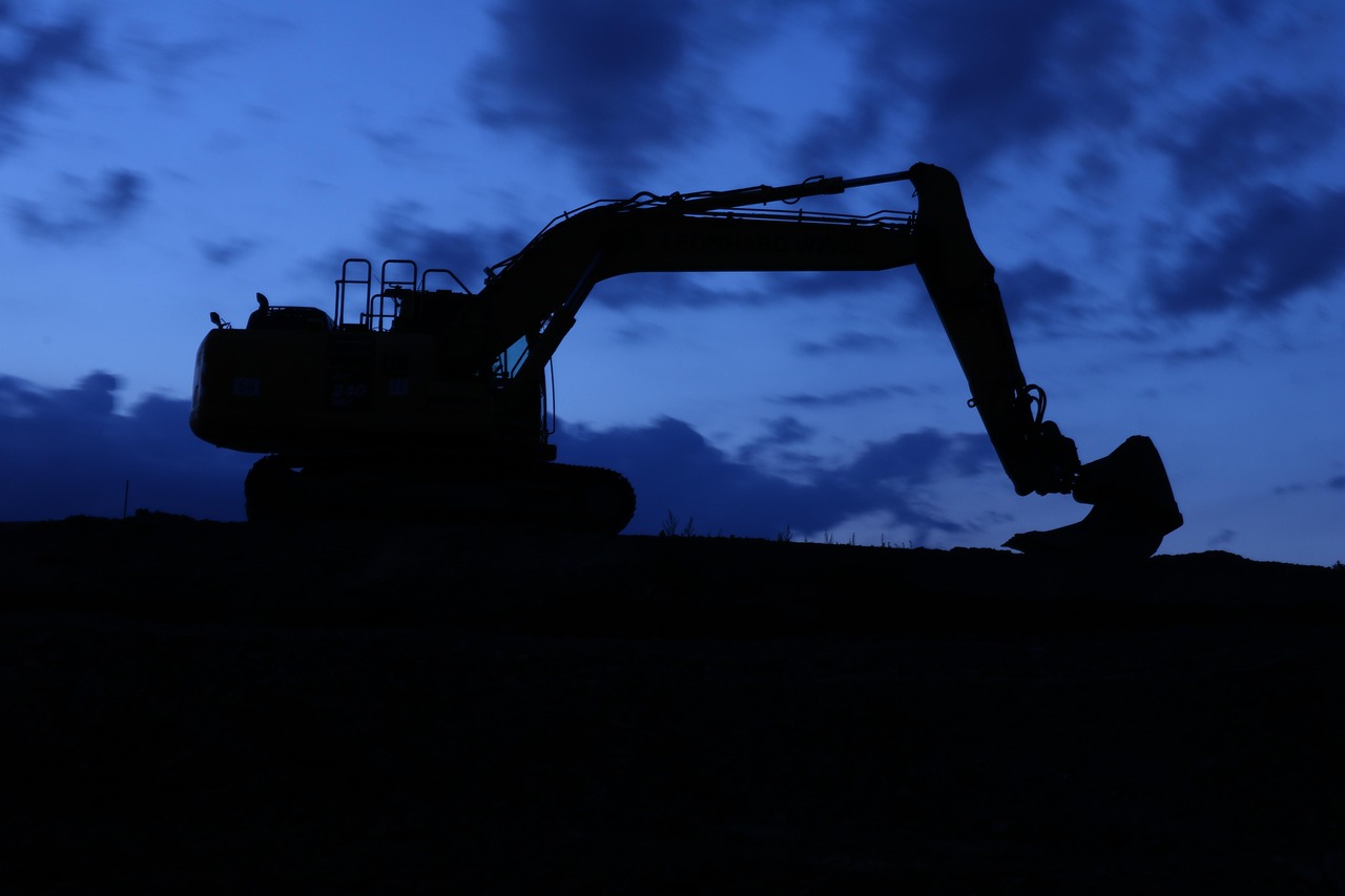 Excavator working frozen ground on a Bozeman, MT site